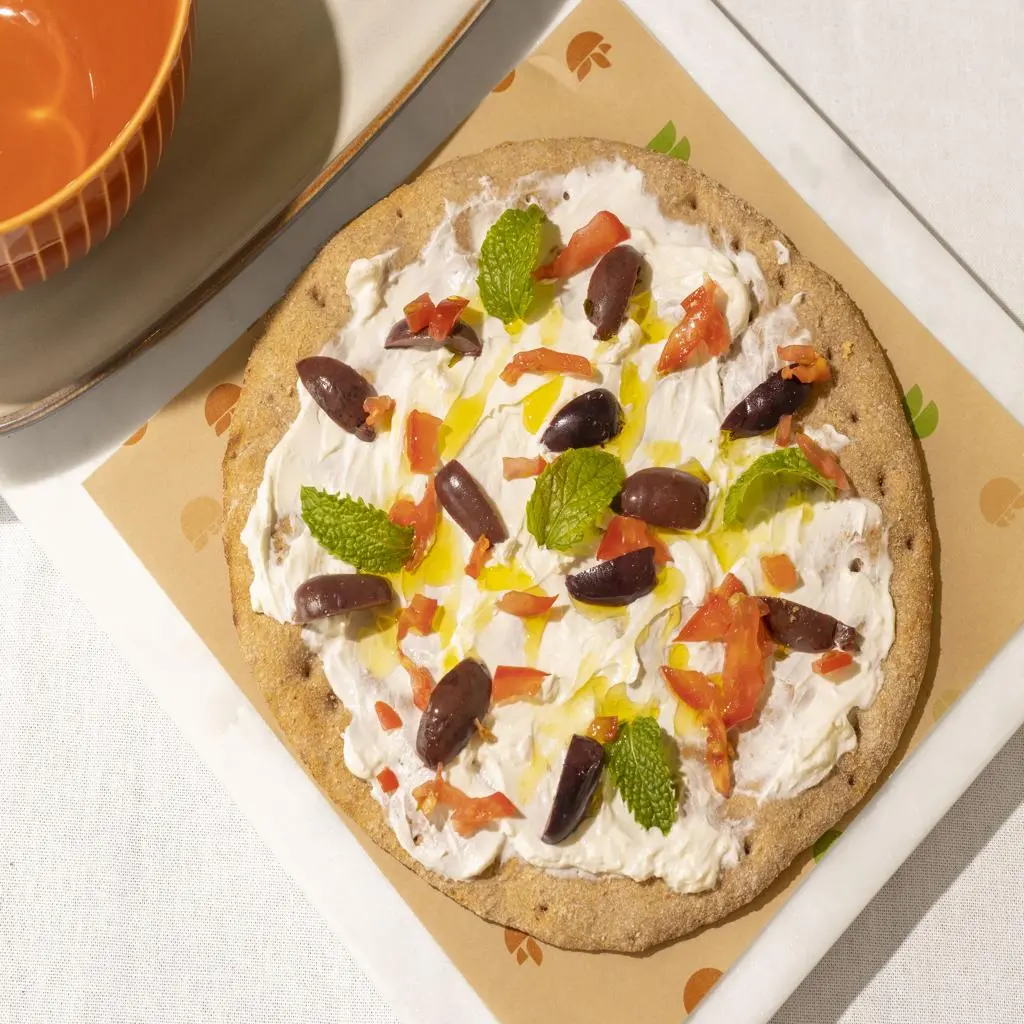Organic Labneh with Olives and Tomatoes Manakish